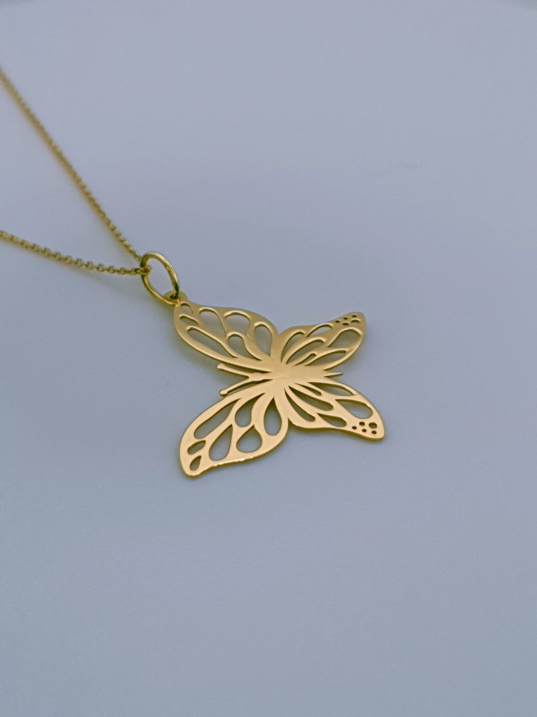 18ct Gold Butterfly necklace, angled photo