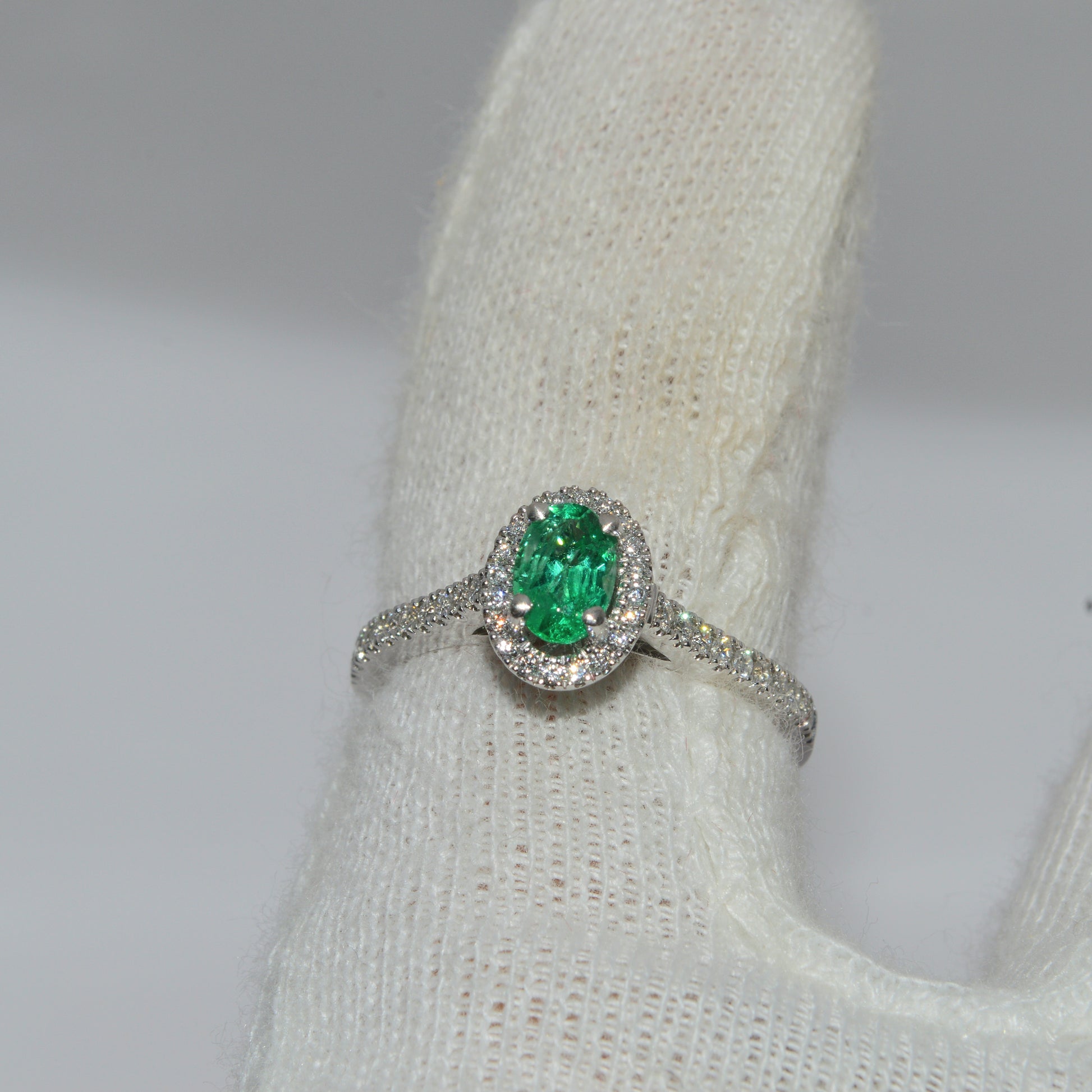 Platinum - Emerald & Diamond Cluster Engagement Ring finger top