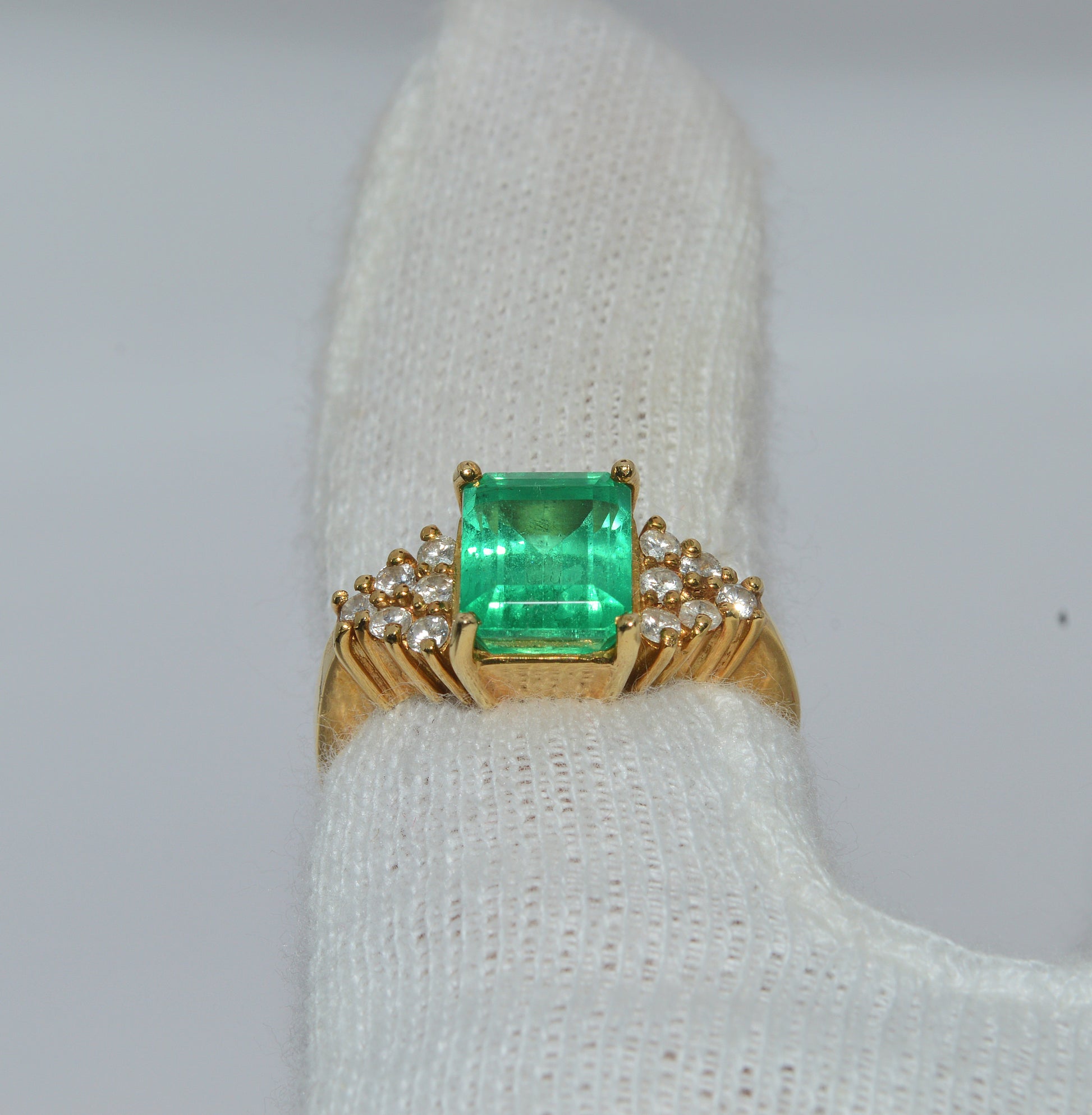 18ct Gold - Colombian Emerald & Diamond Ring tilted finger