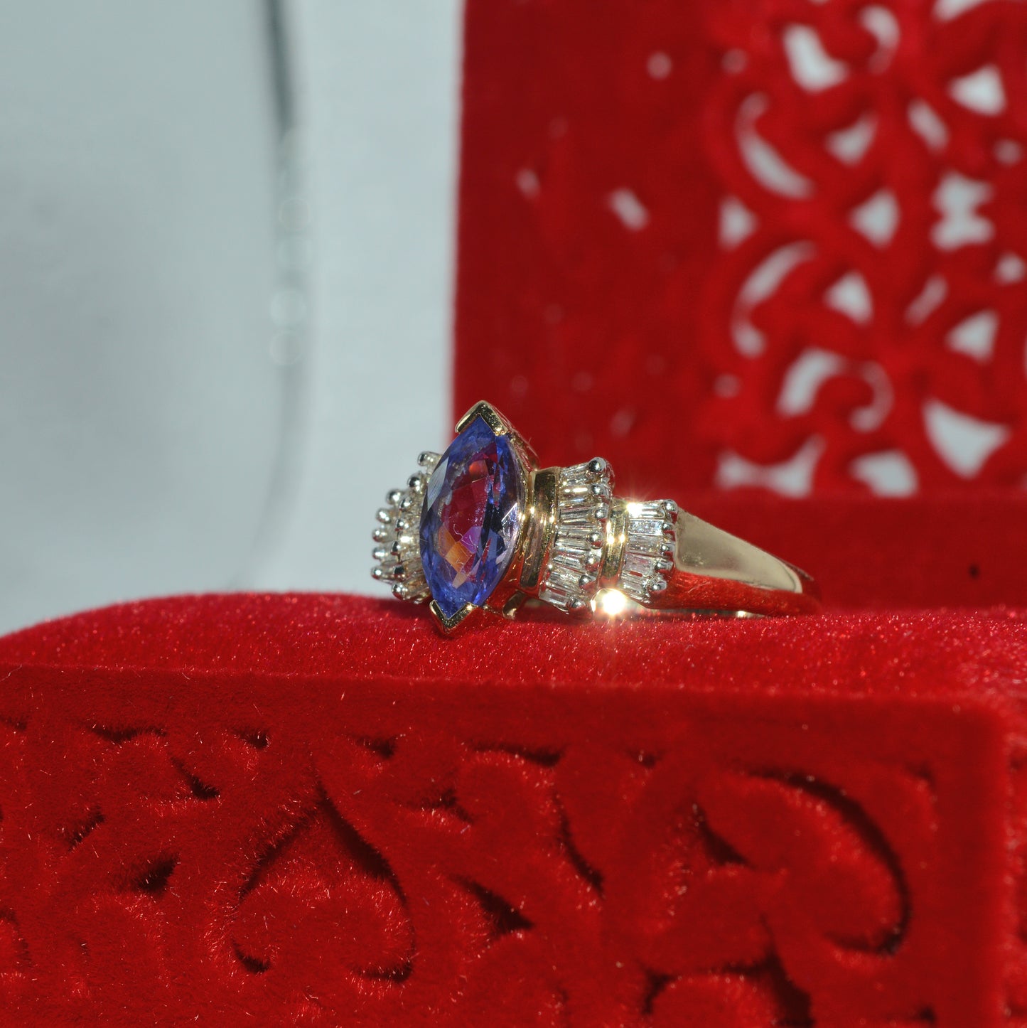 9ct Gold - Marquise Cut Tanzanite & Baguette Diamond Ring left