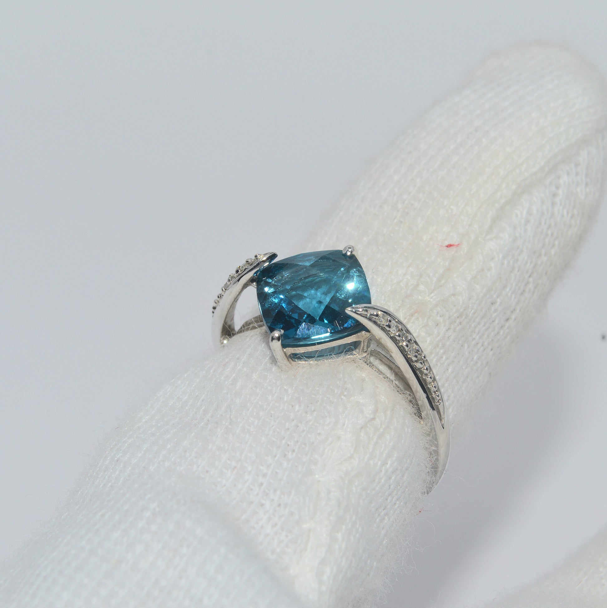 9ct White Gold - Blue Topaz & Diamond Ring finger left tilt