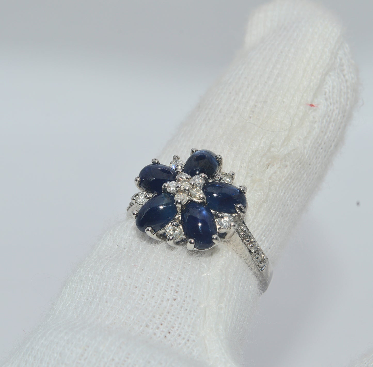 2005 - 9ct White Gold - Sapphire Cabochon & Diamond Cluster Ring finger left