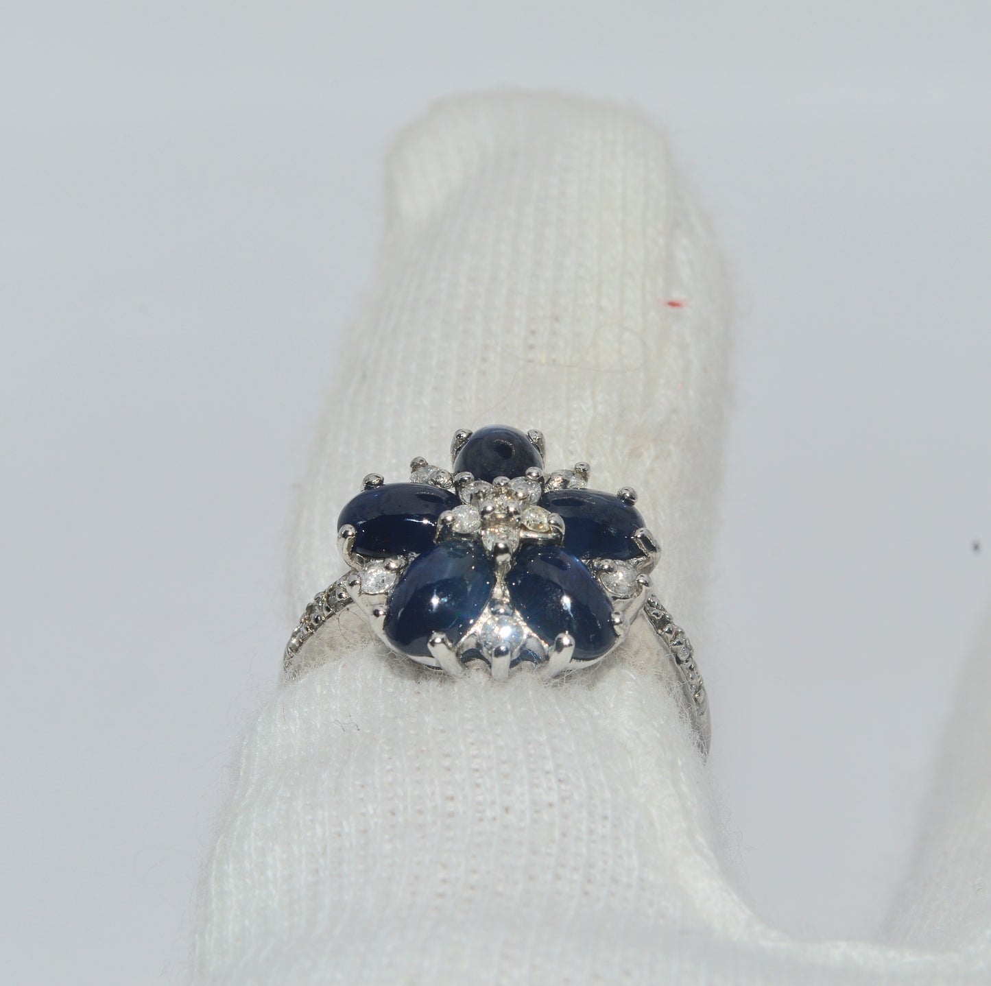 2005 - 9ct White Gold - Sapphire Cabochon & Diamond Cluster Ring finger rear