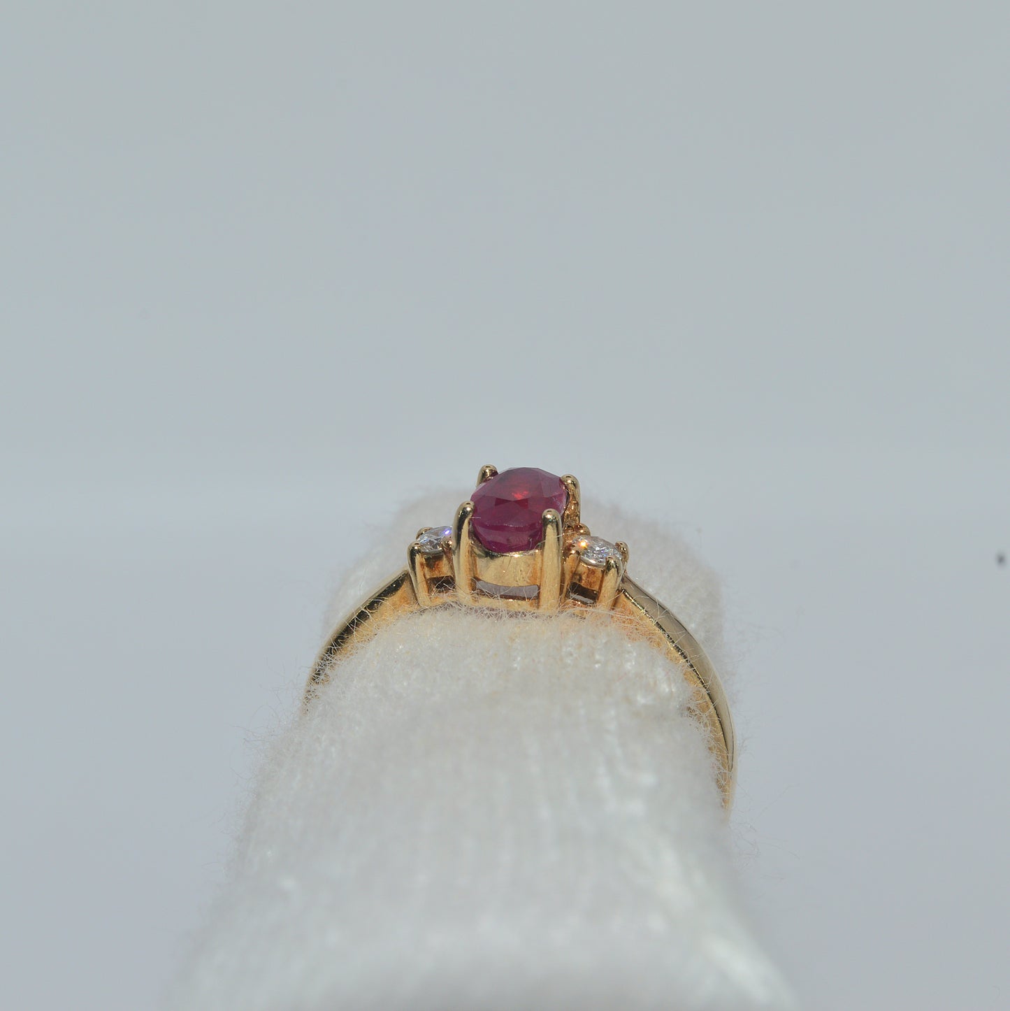 9ct Gold - Ruby & Diamond Trilogy Ring finger rear on