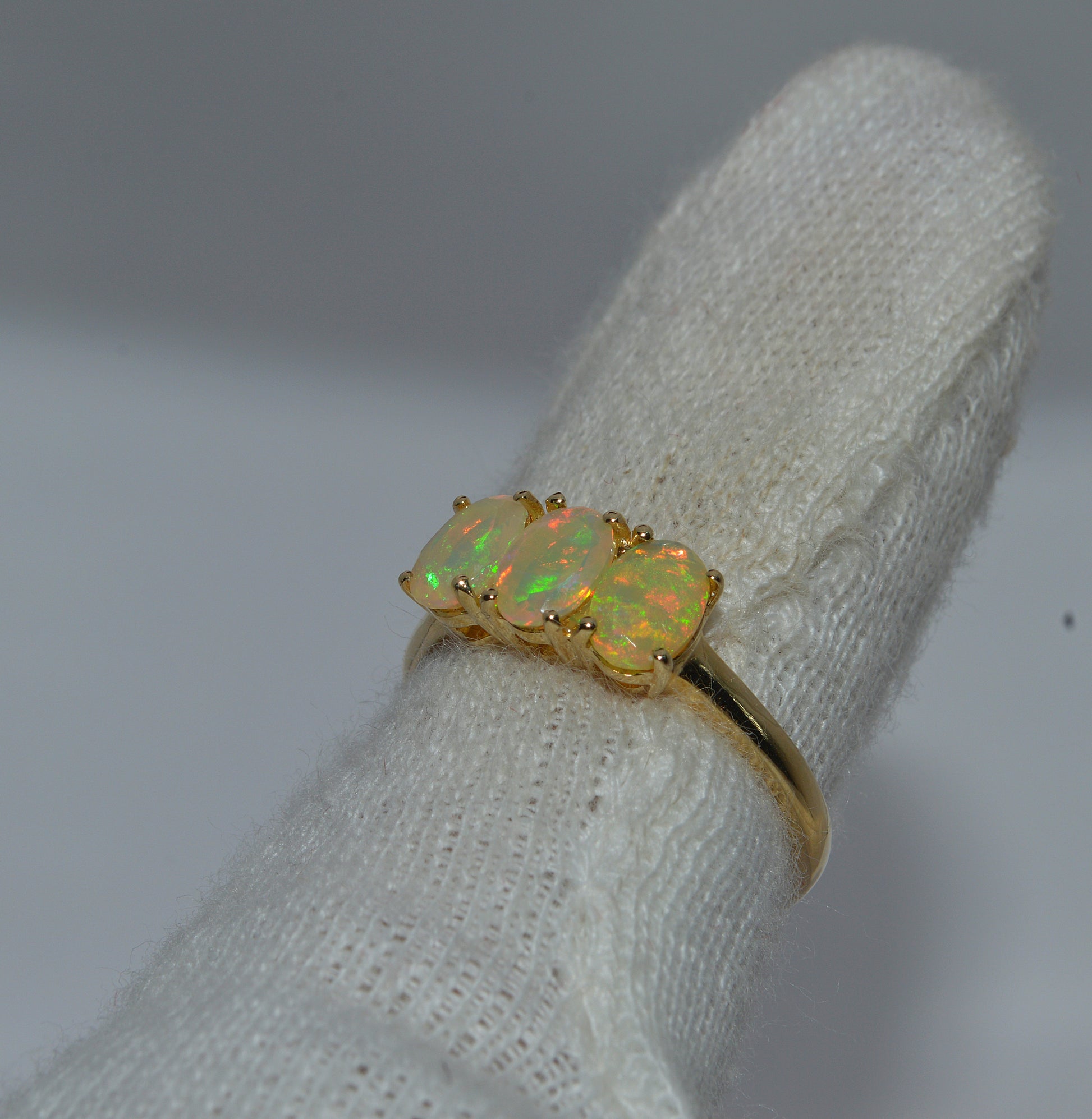 9ct Gold - Ethiopian Opal Trilogy Ring finger left