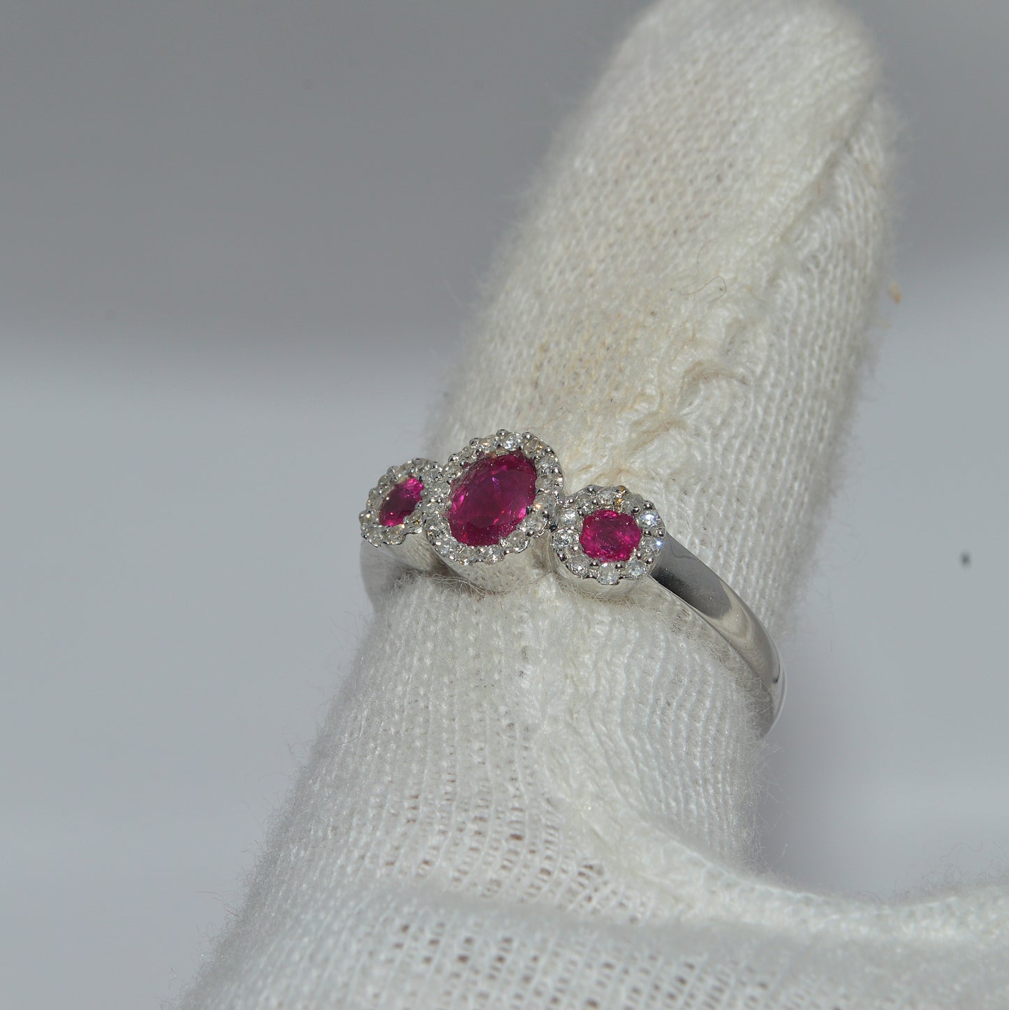 18ct White Gold - Ruby & Diamond Trilogy Ring finger left