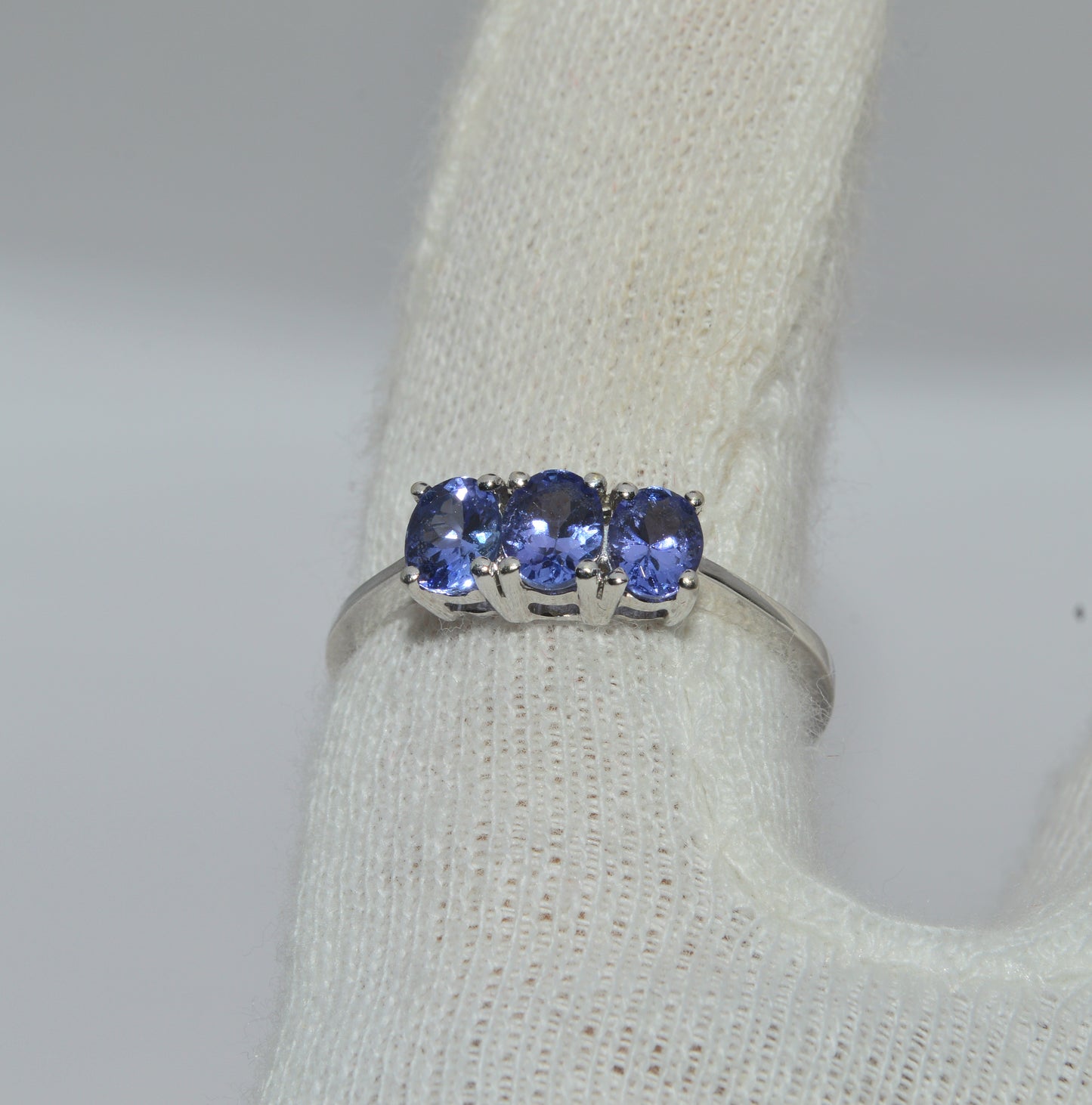 9ct White Gold - Tanzanite Trilogy Ring finger top down