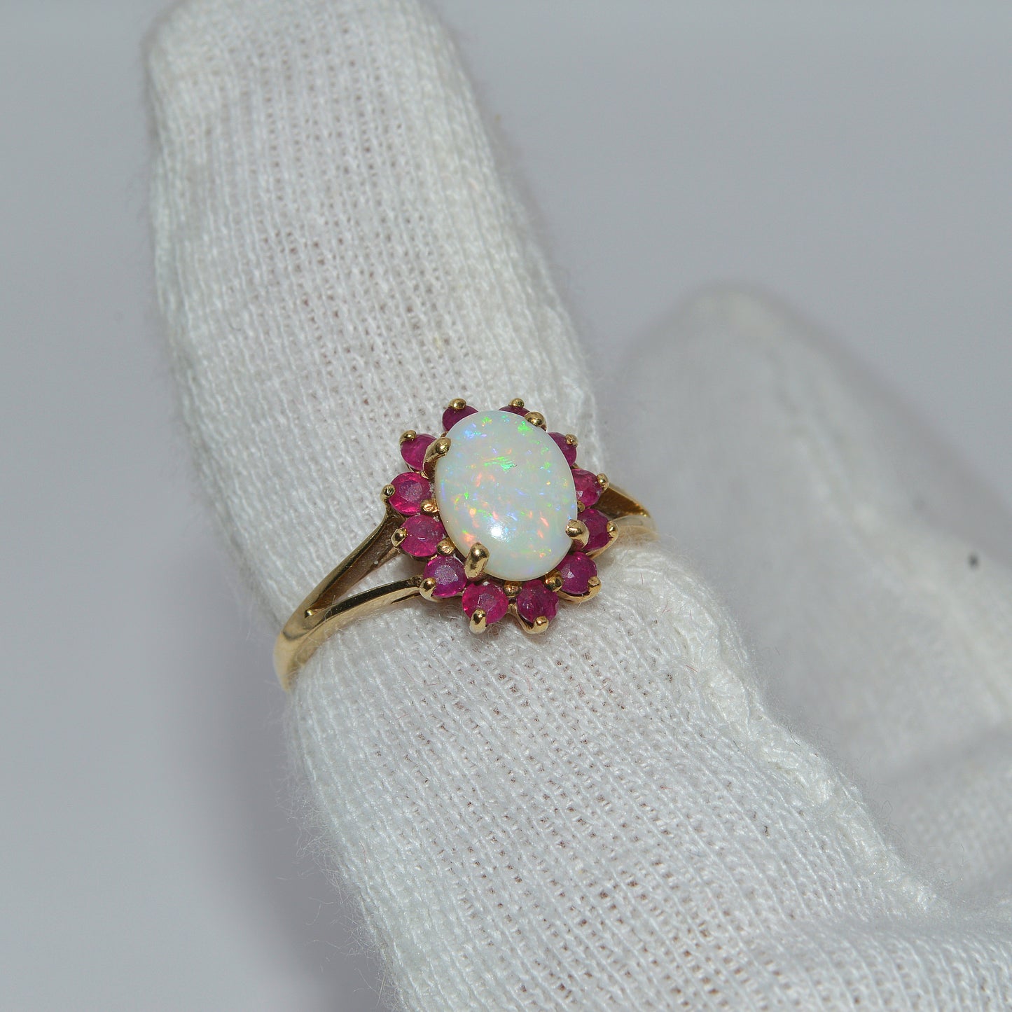 9ct Gold - Opal & Ruby Ring finger right tilt